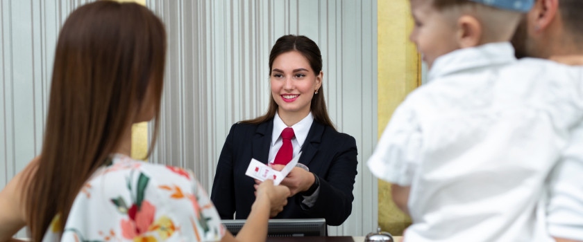 A family checking into a hotel