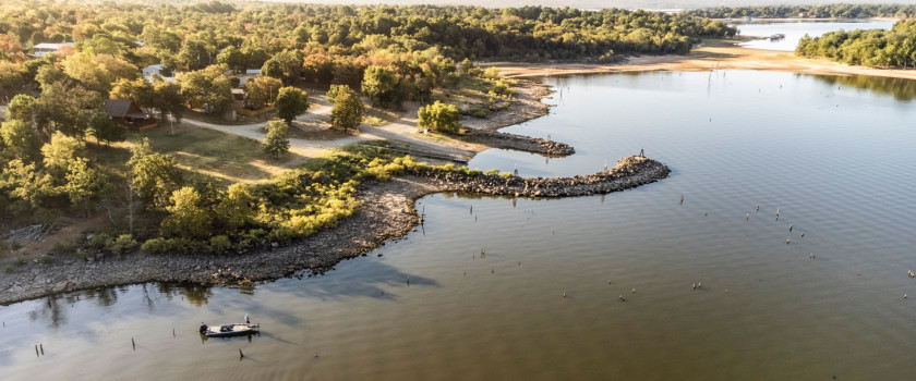 Aerial shot of bass fisherman fishing a shallow point