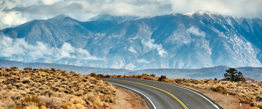 Open highway with mountains in the background in California