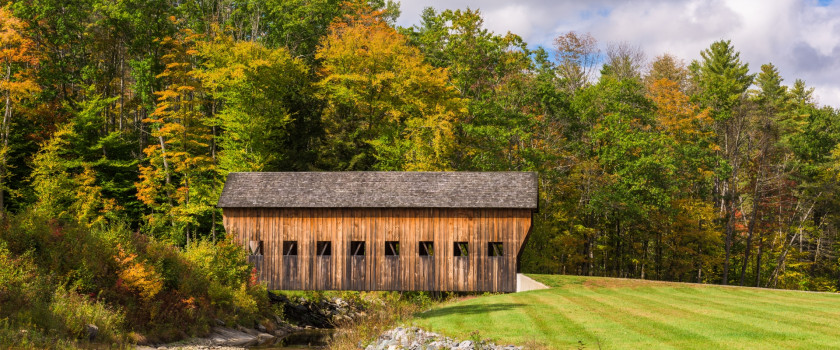 Old barn in a field in rural Vermont during autumn