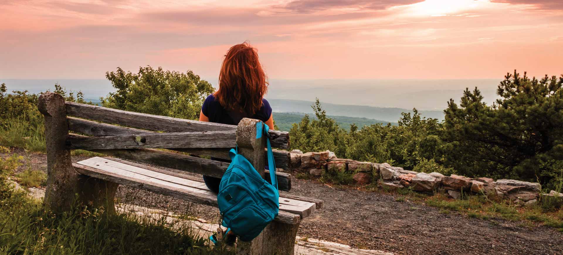 Woman sitting on a bench in High Point State Park