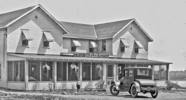 Historic Hotel Saugutuck in Michigan with a classic car in front
