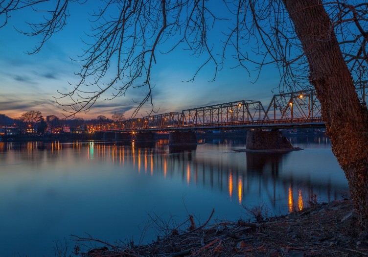 winter scene of lambertville to new hope bridge in the evening